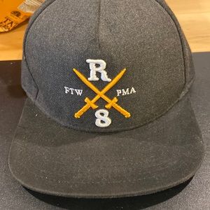 Rebel 8 hat . Snap back black yellow